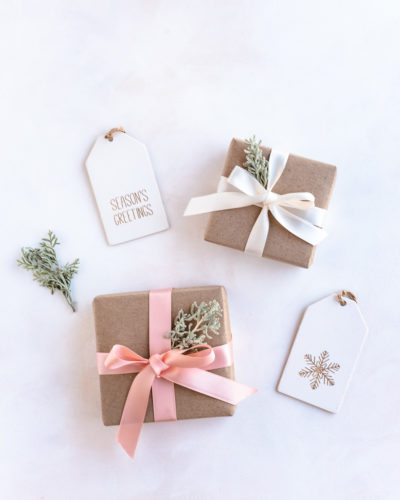 Eco friendly gift wrapping with recyclable craft paper, reusable ribbons and leaves